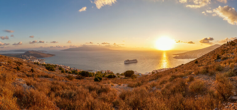 Panoramic view of sunset overIonian Seaseen from coastal hill