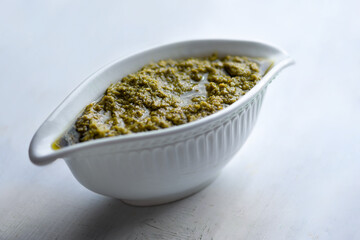bowl of basil pesto sauce
