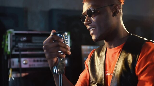 Young african american performer rehearsing in a recording studio