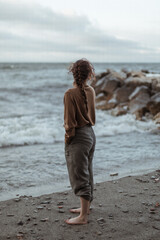 Fototapeta na wymiar Girl Standing in Waves