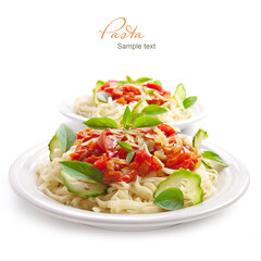 Pasta with tomato sauce basil and grated parmesan on the white plate