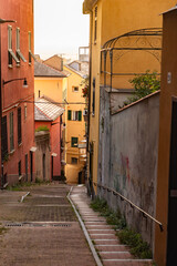 Fototapeta premium Old narrow side street in the old town of Genoa (Genova), Italy