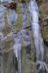 Fototapeta na wymiar Close up of icicles on a rock wall 