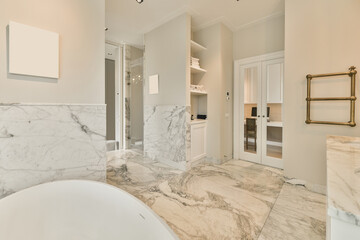 Interior of spacious bathroom with bathtub and heated towel rail