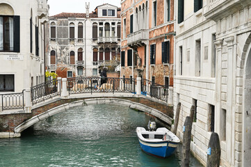 Fototapeta na wymiar Small canal in Venice, Italy