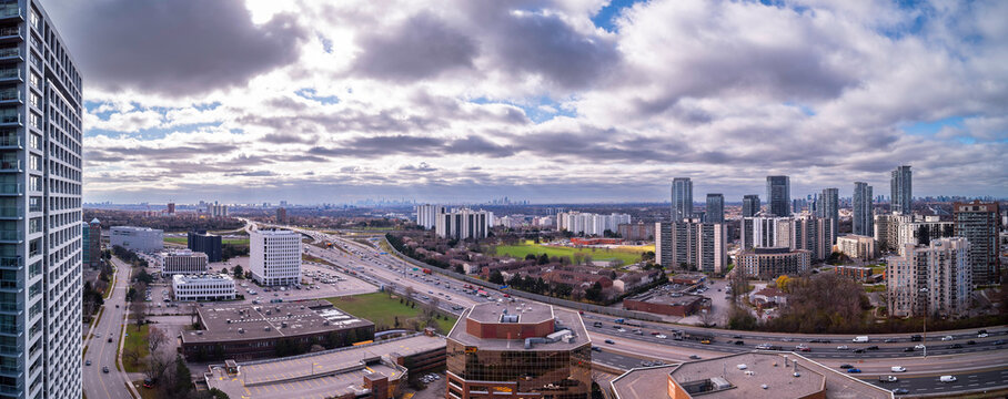 don valley parkway Toronto skyline in the fall with green grass and clouds © contentzilla