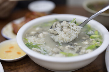 Chaozhou cuisine oyster congee in bowl