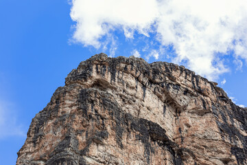 Dolomite rock peak with typical texture and color against blue sky