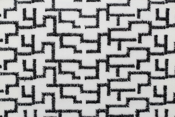 texture of black and white jacquard fabric with geometric pattern