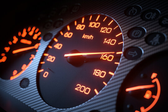 Car dashboard with orange backlighting close up 3D