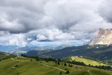 Scenic hiking trail across a high plateau in the Italian Dolomites