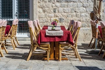 Rattan chairs and table in a street restaurant