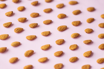 almond seeds on a pink