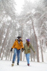 Fototapeta na wymiar Couple in love walking in the snow