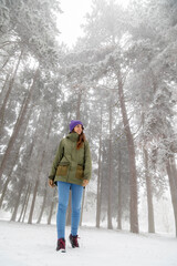 Fototapeta na wymiar Woman walking in the snow