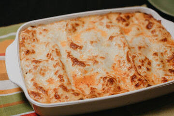 Lasagna in a white bowl photographed from above
