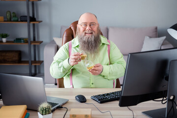 Portrait of attractive cheerful guy top manager working remotely holding sand clock at office...