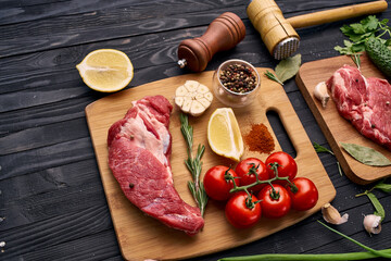 meat vegetables ingredients on a wooden board beef