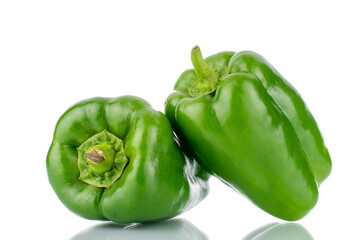 Two sweet green peppers, close-up, isolated on white.