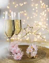 two glasses of champagne and 2022 new years decorations