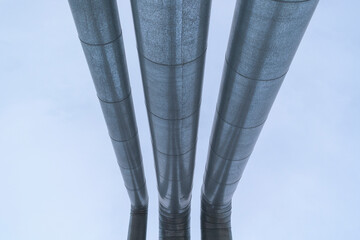 Metal pipes. Stainless steel casing. Perspective view against the blue sky. Concept  gas pipeline,...