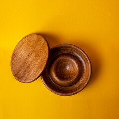 wooden jewelry box with yellow background