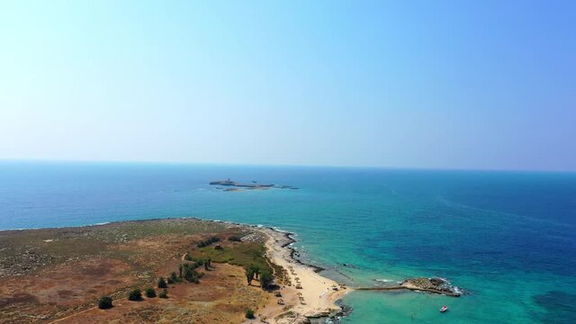 Aerial Beautiful Shot Of Palms Island Against Clear Sky, Drone Flying Over Sea - Tripoli, Lebanon