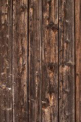wooden burnt old boards with a solid background in a vertical format