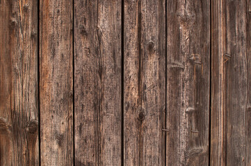 wooden burnt old boards with bent nails solid background