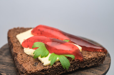Toast with butter, herbs and strawberry jam