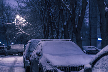 Color Of The Year 2022 - Very Peri. Snowfall and snow-covered car
