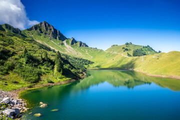 Fototapeta na wymiar Lac De Lessy and Mountain landscape in The Grand-Bornand, France