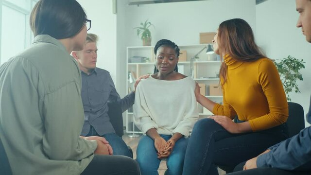 African American Woman Shares Her Personal Addiction Problem, Emotional Pain, Receives Psychological Support, Compassion, Empathy From People in a Group Therapy Session. Abuse, Violence, Depression.