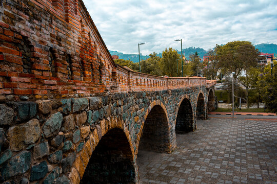 One of the main tourist attractions in the historic center of cuenca, the broken bridge or "El puente roto" in Azuay, Ecuador. Arquitectural heritage in the city downtown with no people. Latin America
