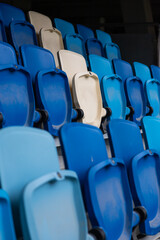 empty colorful seats on tribunes of stadium
