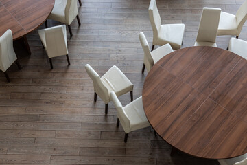 Abstract modern interior of cafe or meeting room with rounded armchairs