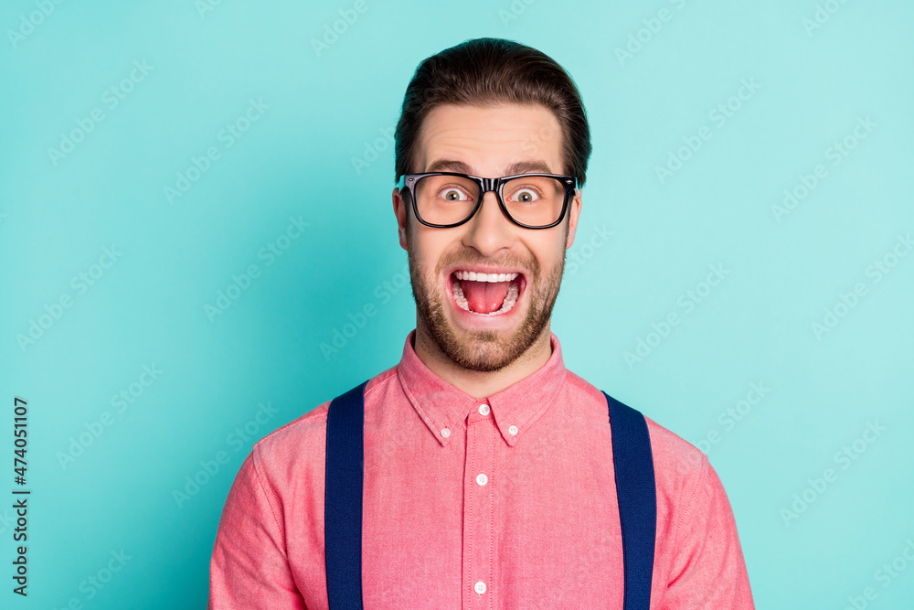 Canvas Prints Photo of young handsome man excited amazed astonished shocked yell isolated over teal color background