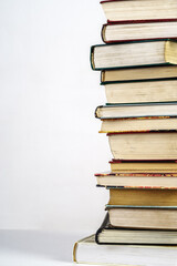 Stack of old books on white background