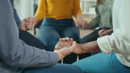 Close-up. A Group Of Mixed-race People Join Hands in a Circle During a Group Therapy Session. Addiction, Violence, Depression. The Concept of Support, Help, Compassion and Empathy.