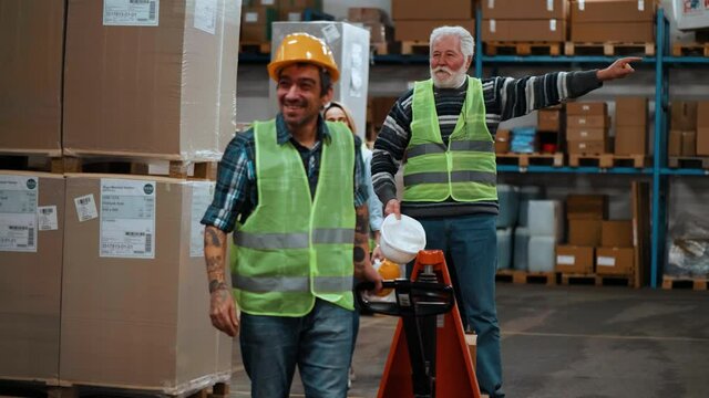 Funny  workers dance in the warehouse