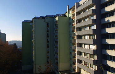 Fototapeta premium Block of flats, urban building, real estate concept. Council tower block. Expensive prices for flats and apartments in the city. 