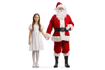 Full length portrait of santa claus holding hand of a girl in a white dress