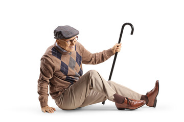 Elderly man with a cane sitting on the floor in pain