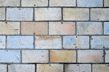 Wall texture. The wall is made of colored bricks.