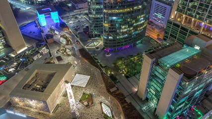 Dubai international financial center skyscrapers aerial night timelapse.
