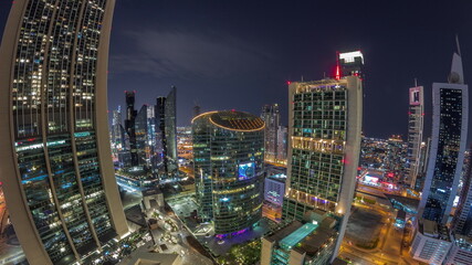 Dubai international financial center skyscrapers aerial all night panoramic timelapse.