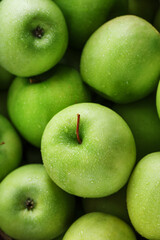 Juicy Green apple close-up with dew drops.