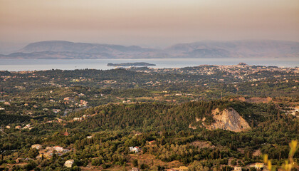 Sunset view over eastern coast of Corfu , Greece.
