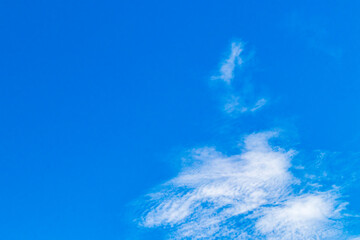 Blue sky with chemical clouds chemical sky chemtrails sunny day.