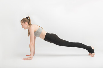 Fototapeta na wymiar Exercise plank. Woman Doing Fitness Exercises. Full plank by Sport Woman. Girl doing yoga on white background.